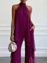 https://cdn.shopify.com/s/files/1/1006/7876/2827/files/WomenPurpleAsymmetricHalterSleevelessElegantTopWithPantsTwo-PieceSet_1.jpg?v=1776287991